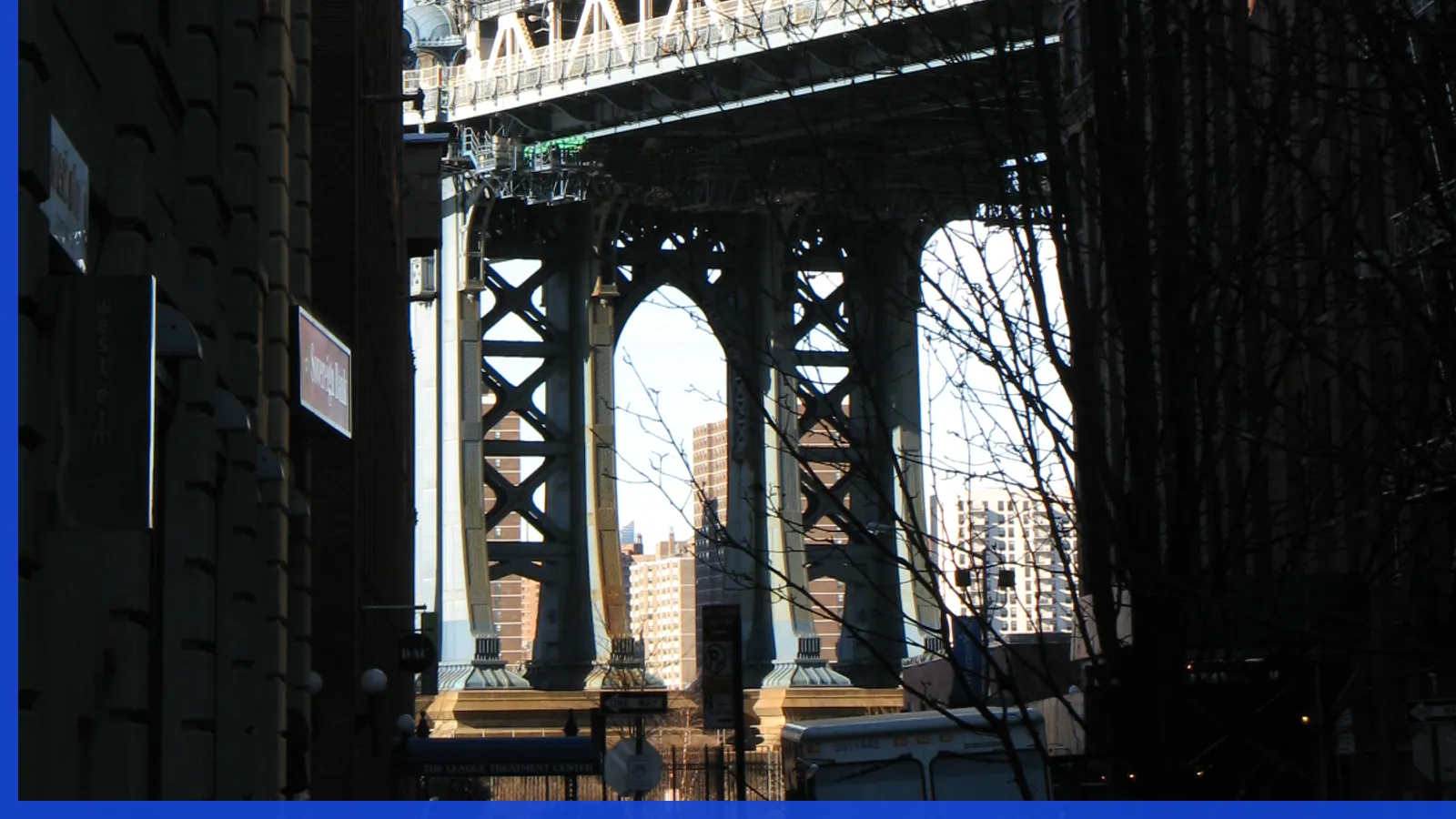A Brooklyn neighborhood streetscape illustrating brooklyn bridge park in Dumbo