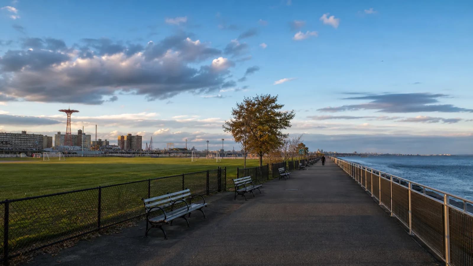 Waterfront path, playing fields, and Gravesend Bay view at Kaiser Park in Coney Island